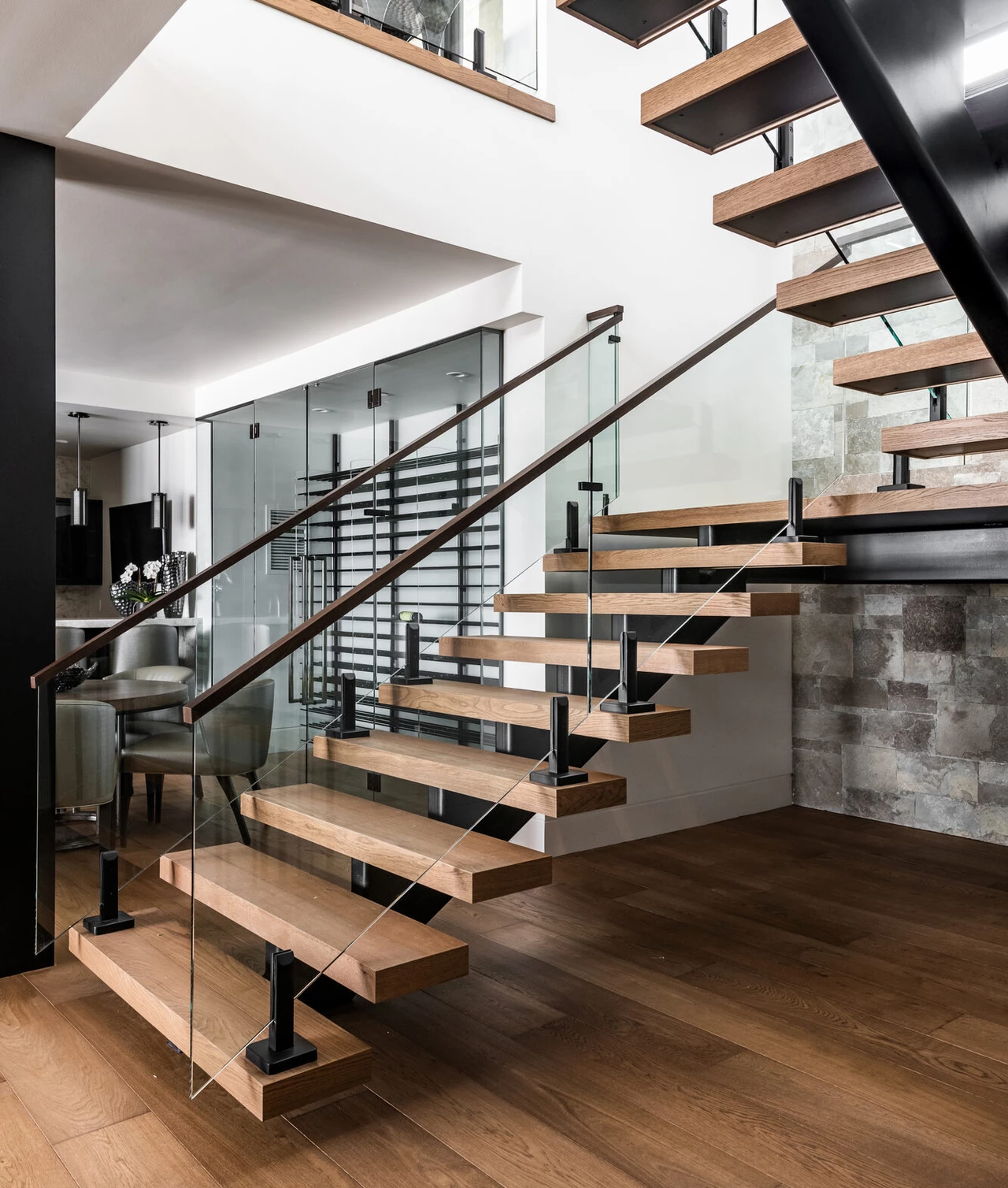 Commercial grade SPC flooring and custom stair treads for high-rise developments.