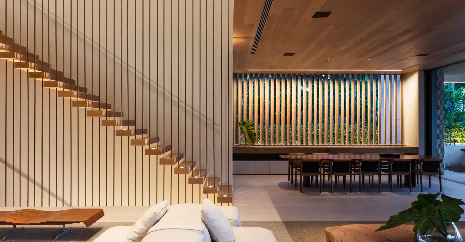 Custom curved staircase and hardwood flooring designed for commercial hotel lobbies.