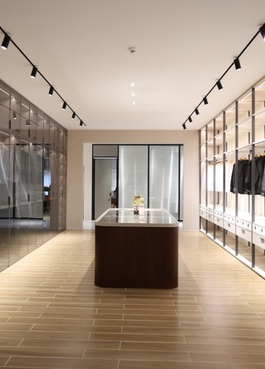 Bespoke walk-in wardrobe and closet systems for luxury apartment interiors.