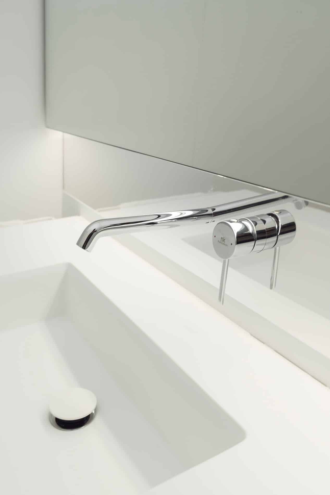 High-end minimalist bathroom design in NIU HOUSES, perfectly executed with our premium sanitary ware and elegant marble look wall tiles.