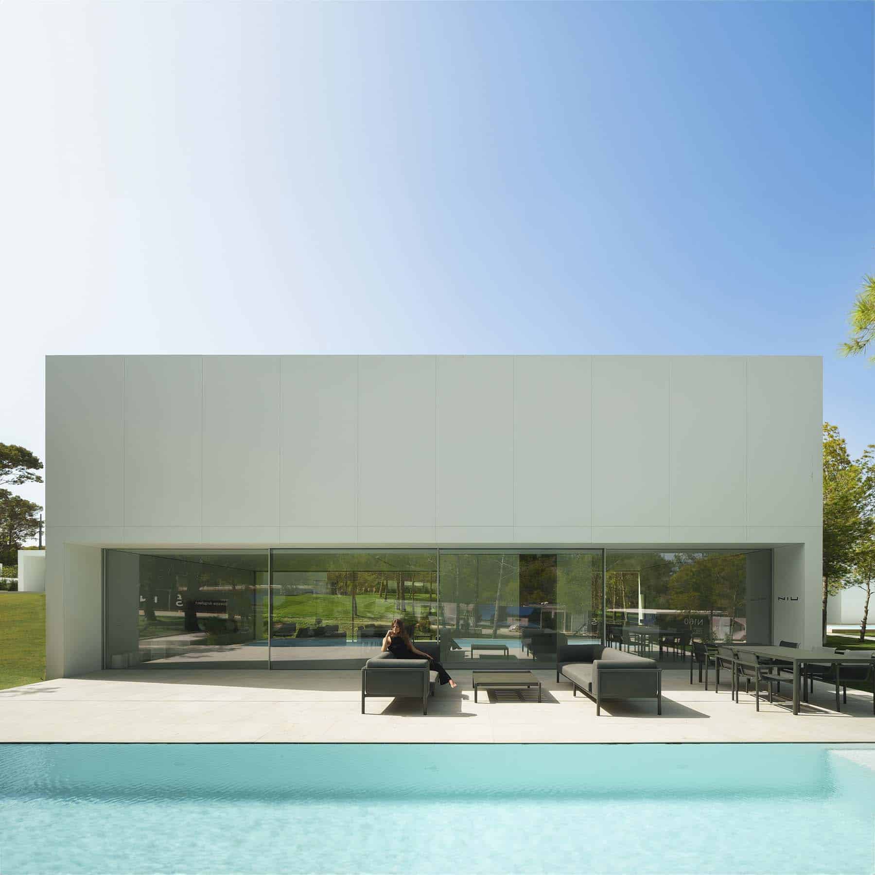 Daytime view of a villa with a swimming pool
