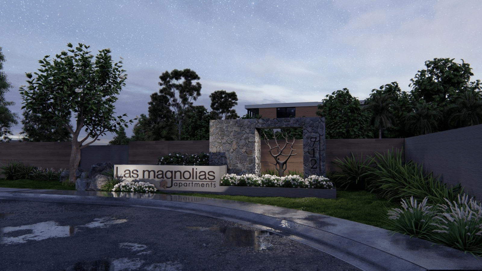 Night view of the Las Magnolias apartments entrance, highlighting the exterior landscape and stone wall materials shipped from China.